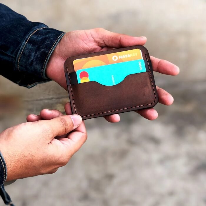 Hand-stitched using durable waxed thread and made from full-grain cowhide leather, this cardholder is perfect for carrying essential cards and a bit of cash without bulk. Ideal for everyday use or as a thoughtful birthday gift for him. themarkleather.co.uk themarkleather.com themarkleather